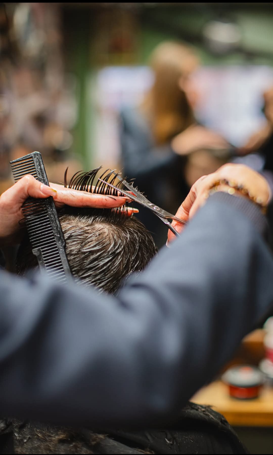 Scissors and comb at work in the chair at Swan Street Barber Shop
