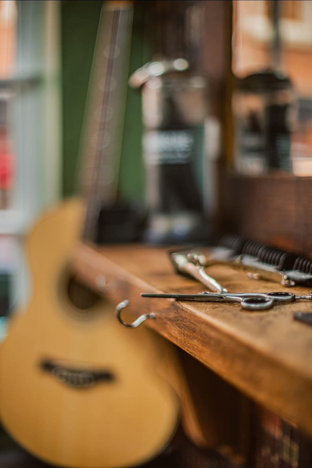 Scissors, clippers and a guitar inside Swan Street Barber Shop
